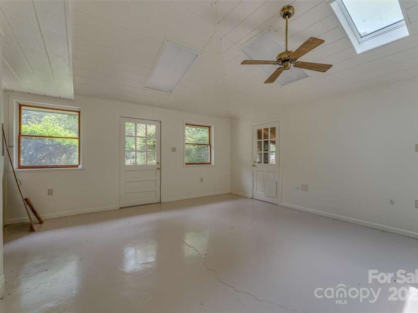 8749 Nc 63 Highway, Leicester, NC 28748.  MLS# CAR4214996, YatesRealty ID 681. Workspace with 8749 garage