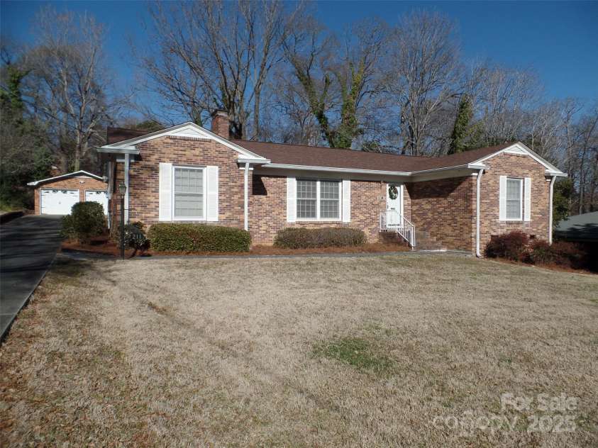 211 Walnut Avenue, Mount Holly, NC 28120.  MLS# CAR4210588, YatesRealty ID 6813. Lovely Brick Ranch in Woodland Park. Two Car Detached Garage,Sun Room and Large Deck.