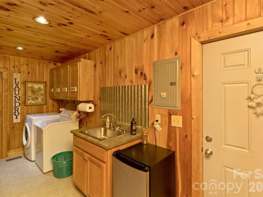 164 Tall Oaks Drive, Maggie Valley, NC 28751.  MLS# CAR4344503, YatesRealty ID 6816. Spacious laundry room.