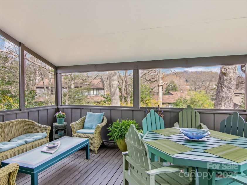 502 Crowfields Lane, Asheville, NC 28803.  MLS# CAR4239571, YatesRealty ID 6818. Large screened porch