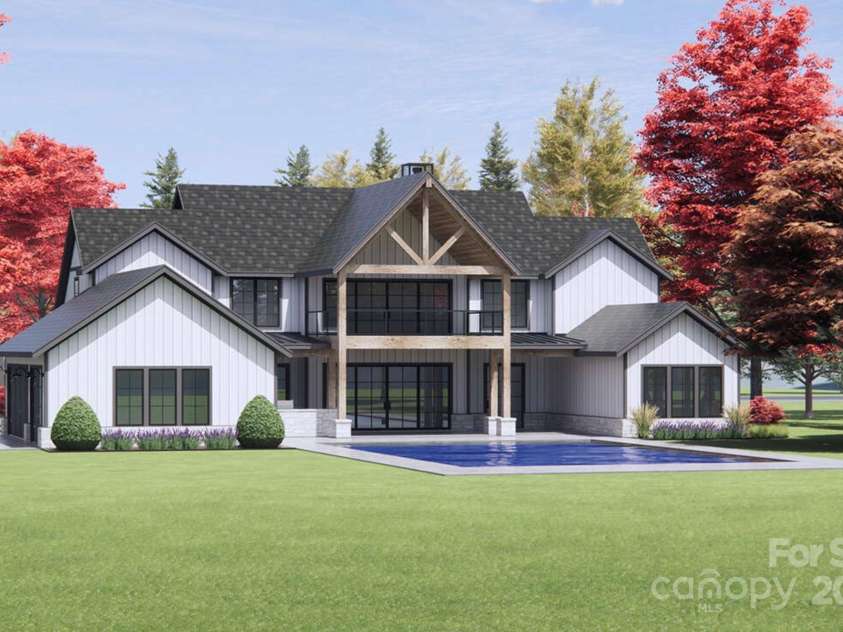 Lot 2 Country Estates Drive, Waxhaw, NC 28173.  MLS# CAR4276573, YatesRealty ID 683. Natural wood posts and trusses under the center gable bring warmth and a touch of rustic flair to the modern exterior. (2nd-story porch and pool not included).
