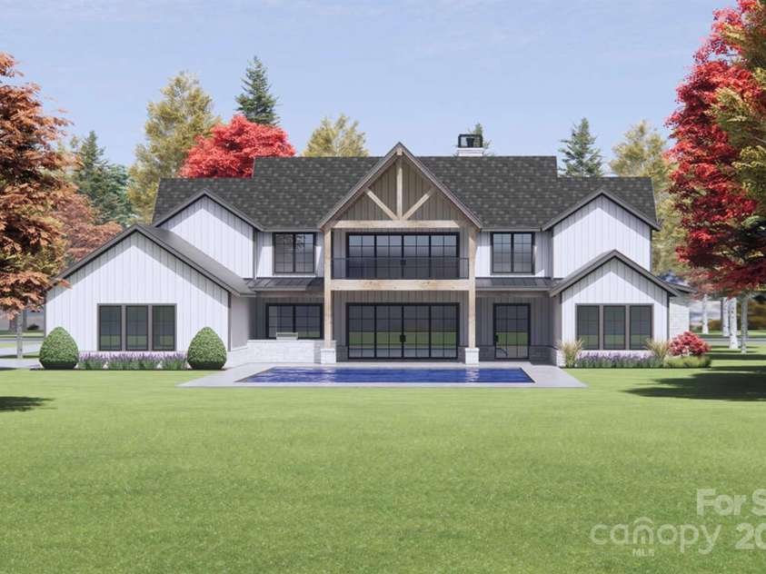 Lot 2 Country Estates Drive, Waxhaw, NC 28173.  MLS# CAR4276573, YatesRealty ID 683. This image features the rear view of the proposed, luxury modern farmhouse, artfully blending rustic charm with sleek, contemporary design. (Pool not included).