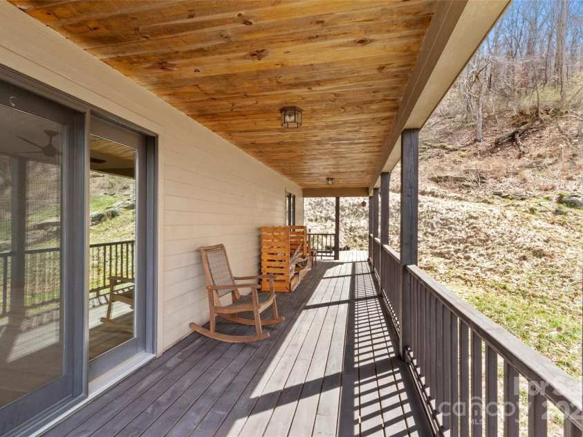 628 Cove Creek Lane, Weaverville, NC 28787.  MLS# CAR4240131, YatesRealty ID 6834. Back Covered Deck