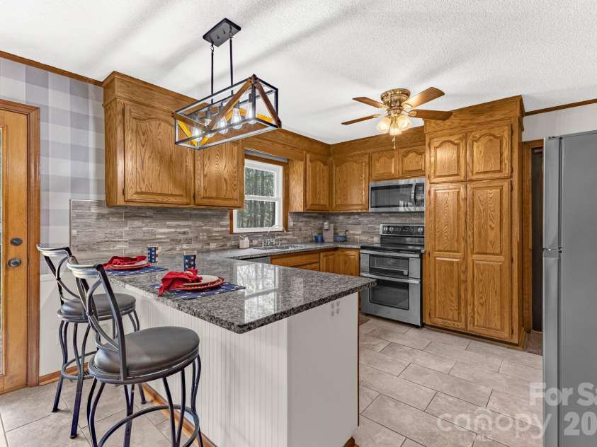 3921 Peach Street, Newton, NC 28658.  MLS# CAR4357267, YatesRealty ID 6838. Kitchen on main level