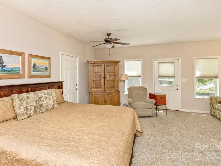 15 Beaverdam Knoll Road, Asheville, NC 28804.  MLS# CAR4283730, YatesRealty ID 684. Downstairs is a generous studio apartment with a sitting area, kitchenette and full bathroom. The single-car garage/workshop is adjacent and there is a separate paved driveway, parking area and private entrance.