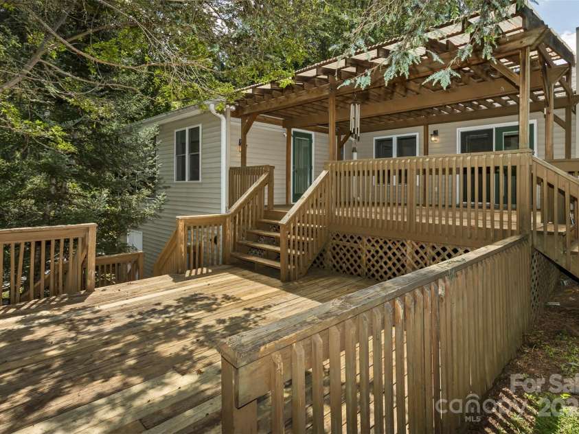 15 Beaverdam Knoll Road, Asheville, NC 28804.  MLS# CAR4283730, YatesRealty ID 684. The lower deck is ample for a completely separate outdoor seating area as well as a hot tub.