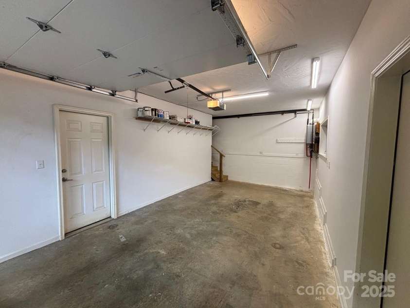 15 Beaverdam Knoll Road, Asheville, NC 28804.  MLS# CAR4283730, YatesRealty ID 684. The lower level garage provides easy, no-step entry into the studio apartment. Additionally, the crawlspace is easily accessible from a large door located inside the lower garage.