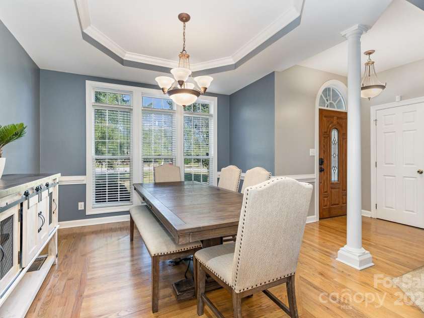 9404 Perimeter Court, Zebulon, NC 27597.  MLS# CAR4191333, YatesRealty ID 6842. Large dining room with tray ceiling and crown molding detail- view 2