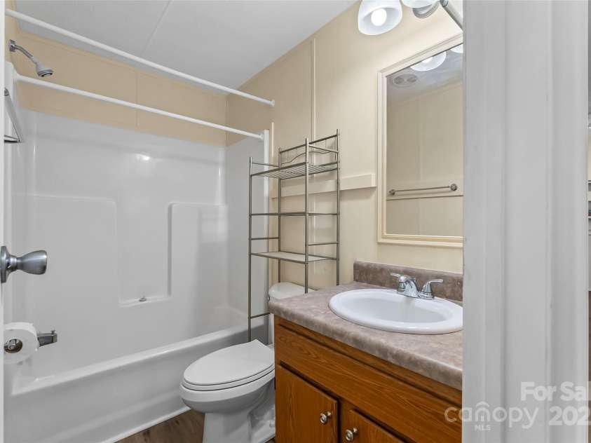 4 Saint Matthews Drive, Candler, NC 28715.  MLS# CAR4241573, YatesRealty ID 6844. Hall Bathroom