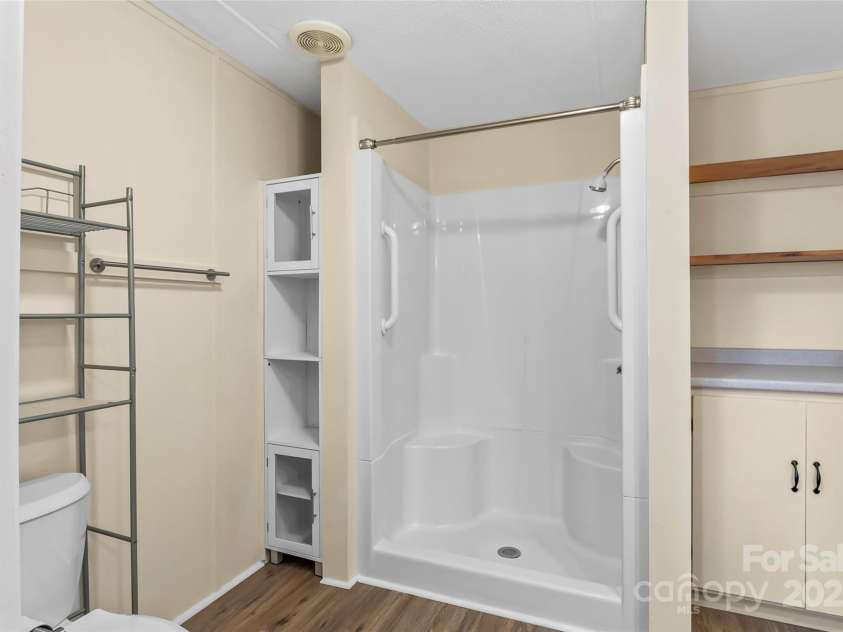 4 Saint Matthews Drive, Candler, NC 28715.  MLS# CAR4241573, YatesRealty ID 6844. Large shower in primary bathroom
