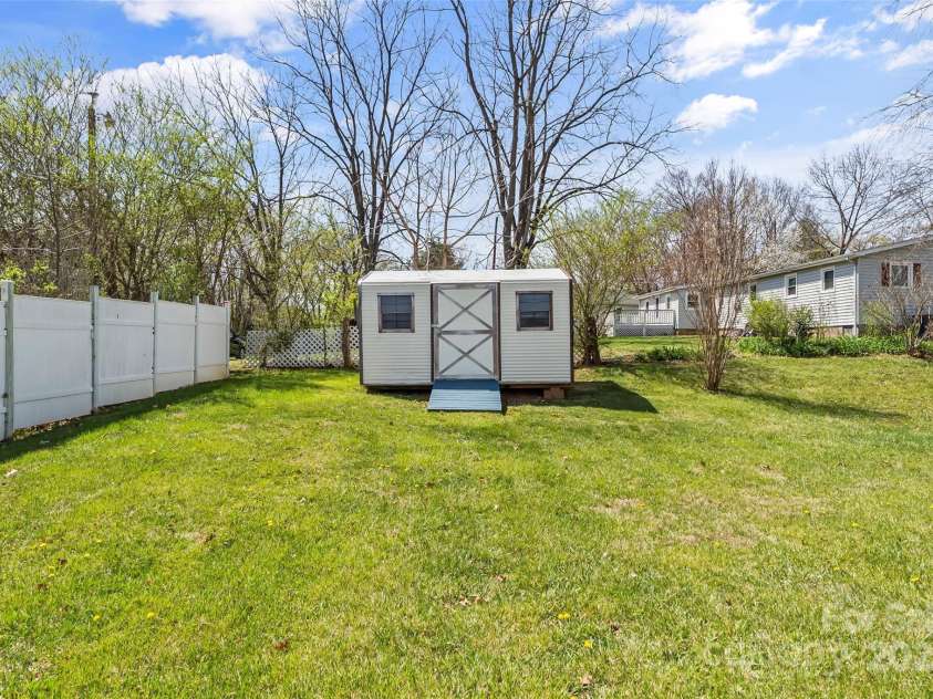 4 Saint Matthews Drive, Candler, NC 28715.  MLS# CAR4241573, YatesRealty ID 6844. Metal Shed