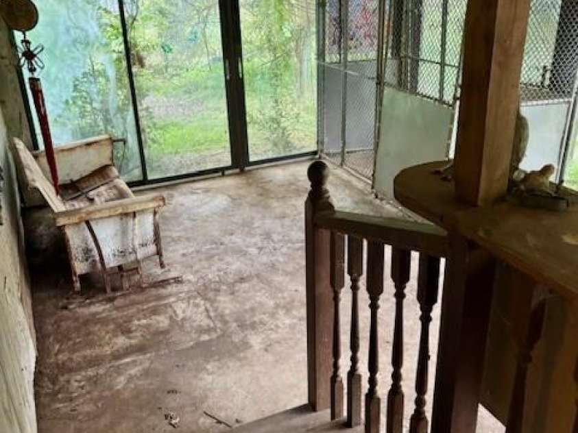 6000 Main Street, Salisbury, NC 28147.  MLS# CAR4248591, YatesRealty ID 6845. ACTUAL - BACKDOOR STEPS DOWN INTO A SUNROOM WITH CONCRETE FLOOR. ROOM NEEDS WORK & HAS SEVERE WATHER DAMAGE ON CEILING DUE TO THE ROOF DESIGN & MATERIAL.THIS COULD BE REMOVED AND CONVERTED TO A PATIO