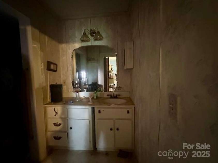 6000 Main Street, Salisbury, NC 28147.  MLS# CAR4248591, YatesRealty ID 6845. ACTUAL - CURRENT VANITY AREA OF THE PRIMARY BATH - SO MANY GREAT POSSIBILITIES!