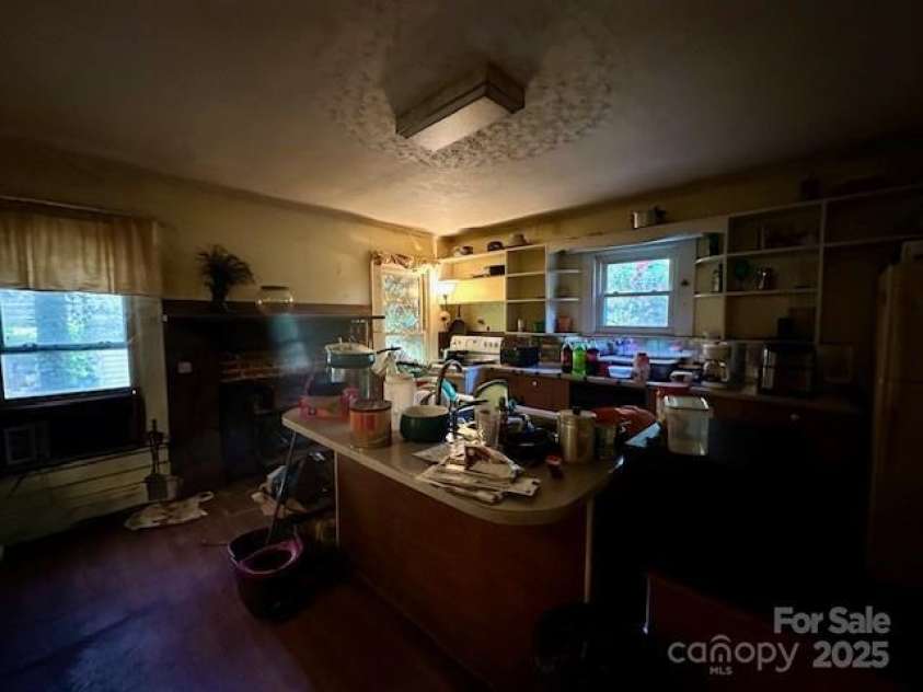6000 Main Street, Salisbury, NC 28147.  MLS# CAR4248591, YatesRealty ID 6845. ACTUAL - KITCHEN - SPACIOUS WITH CENTER ISLAND BREAKFAST BAR, WOOD FLOORS, FIREPLACE AND BUILT-IN CORNER CABINET