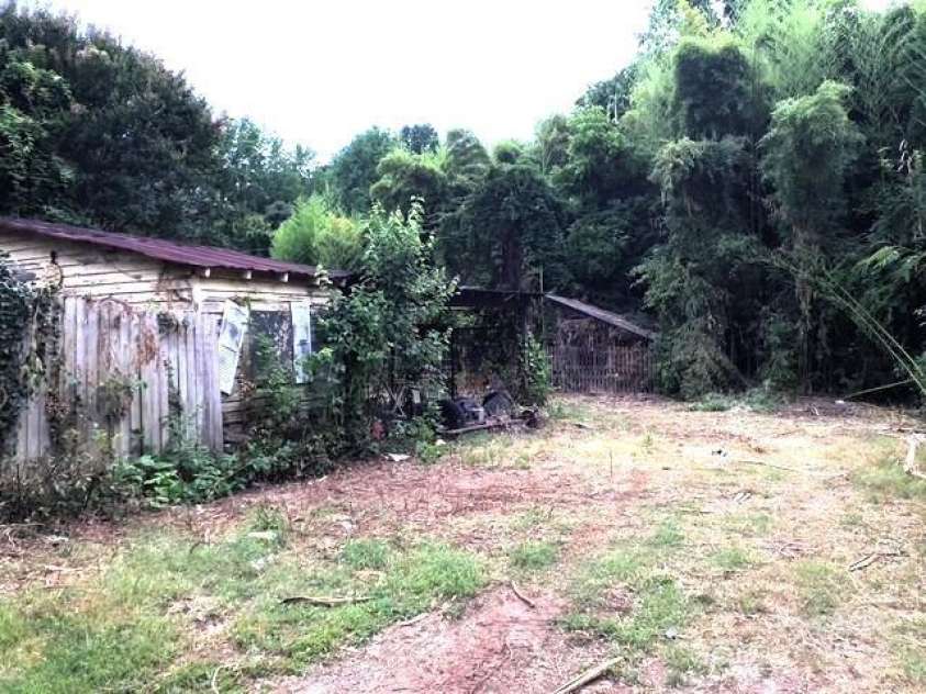 6000 Main Street, Salisbury, NC 28147.  MLS# CAR4248591, YatesRealty ID 6845. ACTUAL - ON THE DRIVEWAY SIDE OF HOUSE, HEADING BACK TO THE BARN. PARKING SHELTER ON THE LEFT WITH A STORAGE AREA