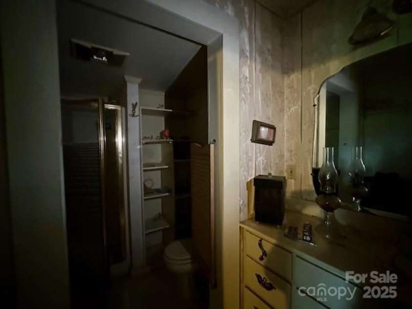 6000 Main Street, Salisbury, NC 28147.  MLS# CAR4248591, YatesRealty ID 6845. ACTUAL - PRIMARY FULL BATH - STAND UP SHOWER, TOILET IS SEPARATED FROM VANITY AREA BY VINTAGE SWINGING SHUTTERS
