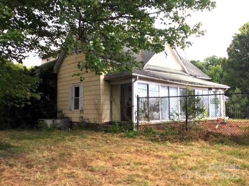 6000 Main Street, Salisbury, NC 28147.  MLS# CAR4248591, YatesRealty ID 6845. ACTUAL - VIEW FROM THE FRONT AREA OF THE SIDE YARD. THIS PORCH COULD BE A BEAUTIFUL ROCKING CHAIR PORCH