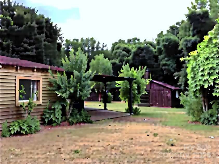 6000 Main Street, Salisbury, NC 28147.  MLS# CAR4248591, YatesRealty ID 6845. *VIRTUAL IMAGE* SHOWING THE PARKING SHELTER AND STORAGE BUILDING.