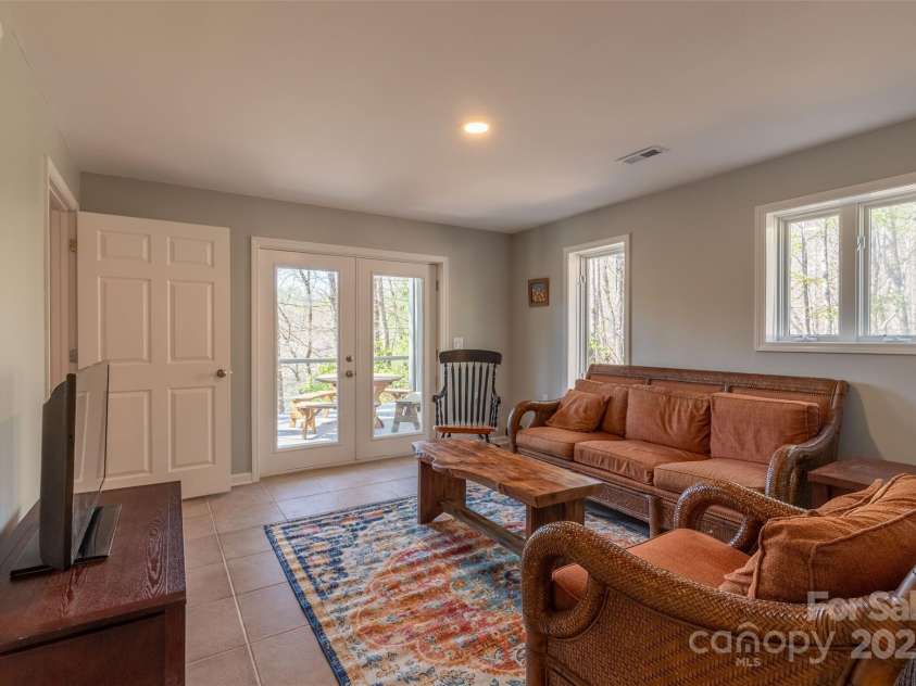 136 Dars Lane, Tuckasegee, NC 28783.  MLS# CAR4248083, YatesRealty ID 6851. Basement Family Room