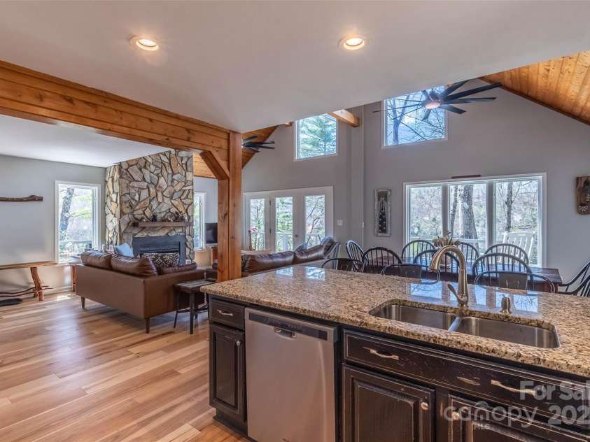 136 Dars Lane, Tuckasegee, NC 28783.  MLS# CAR4248083, YatesRealty ID 6851. Kitchen looking into dining area and living room