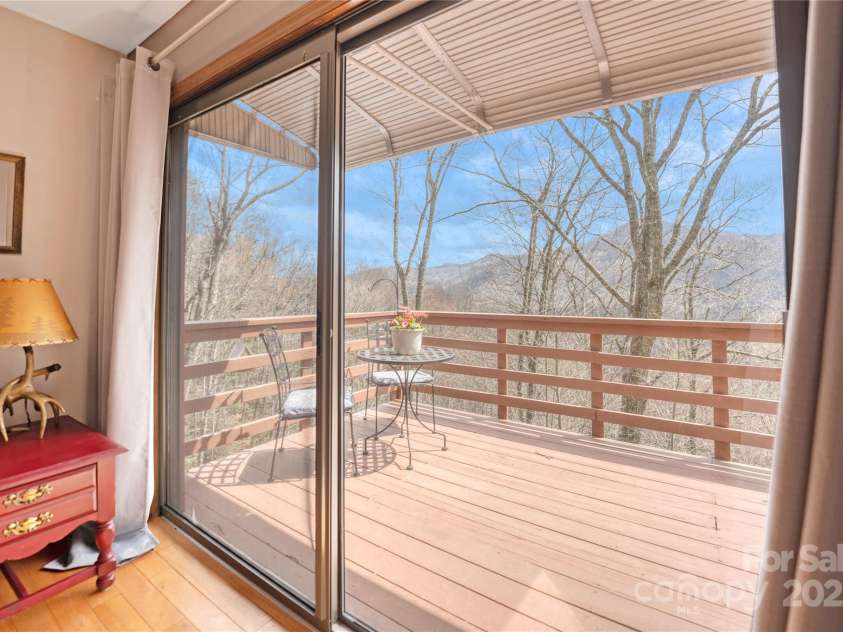243 Old Still Road, Maggie Valley, NC 28751.  MLS# CAR4237252, YatesRealty ID 6857. Front deck off living room