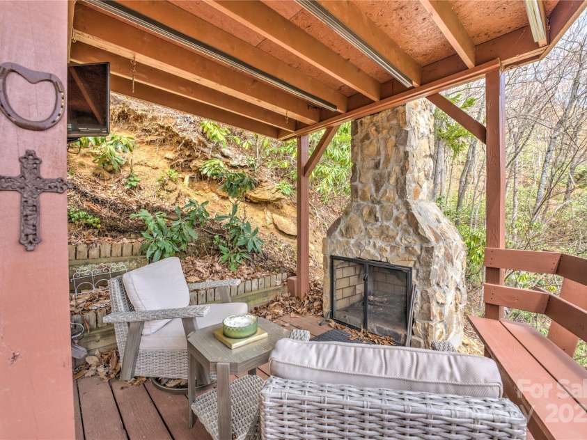 243 Old Still Road, Maggie Valley, NC 28751.  MLS# CAR4237252, YatesRealty ID 6857. Outdoor fireplace