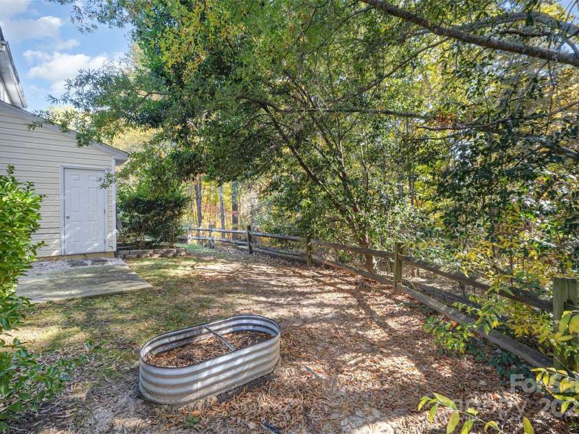 8230 Rudolph Road, Charlotte, NC 28216.  MLS# CAR4319455, YatesRealty ID 6859. Backyard w/ patio