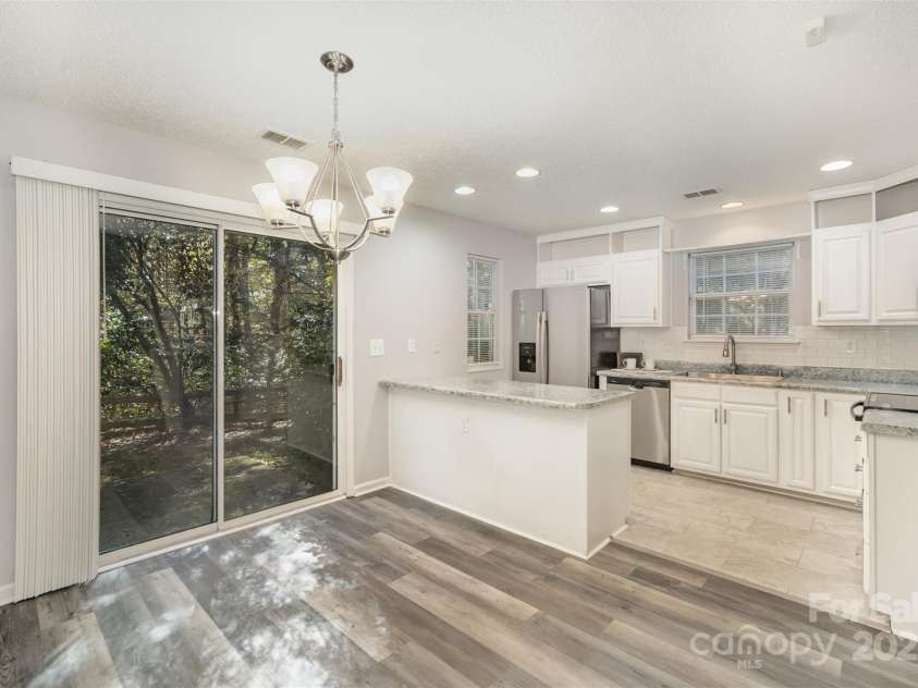 8230 Rudolph Road, Charlotte, NC 28216.  MLS# CAR4319455, YatesRealty ID 6859. Dining area into kitchen