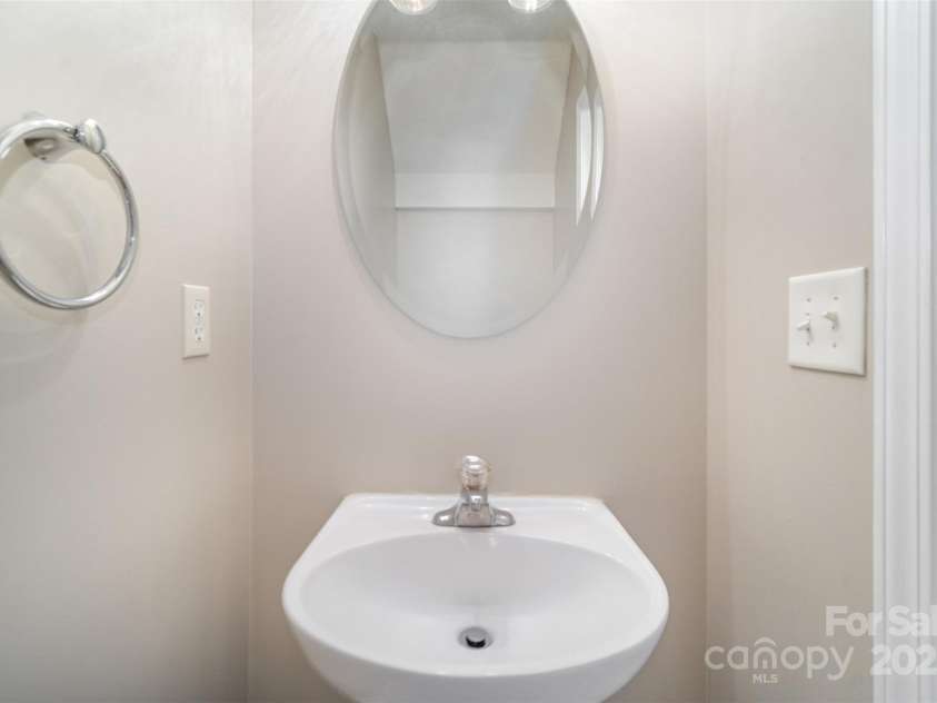 8230 Rudolph Road, Charlotte, NC 28216.  MLS# CAR4319455, YatesRealty ID 6859. Main level half bath