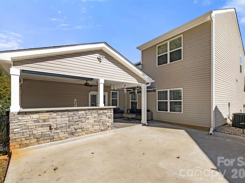 1828 Kilkenny Drive, Clover, SC 29710.  MLS# CAR4316666, YatesRealty ID 6860. Back of home--outdoor kitchen, covered porch and patio