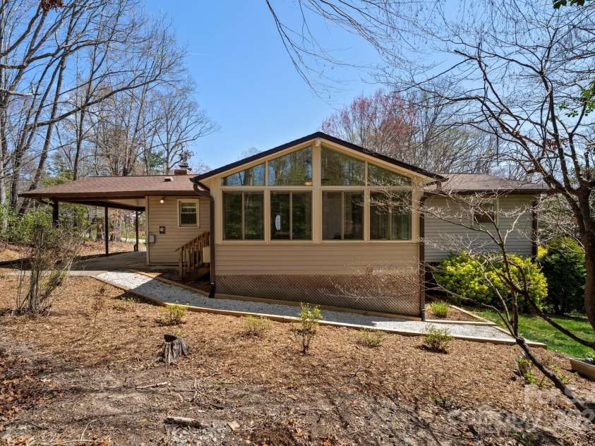 11 Hudson Lane, Fletcher, NC 28732.  MLS# CAR4241916, YatesRealty ID 6867. Showing the sunroom!