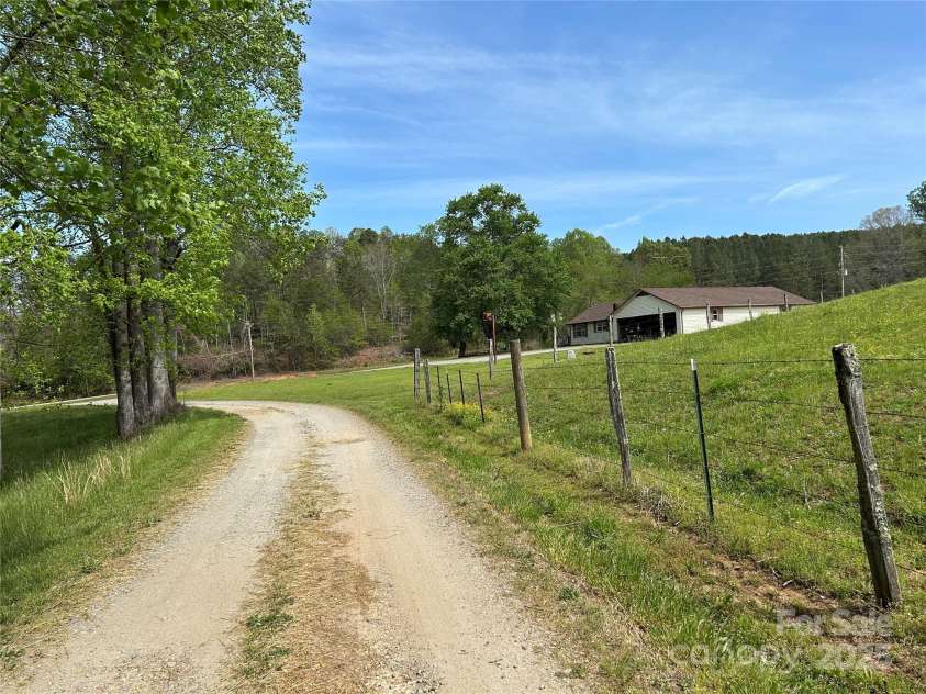 621 Pleasant Grove Road, Rutherfordton, NC 28139.  MLS# CAR4208576, YatesRealty ID 6871. The road coming back to the house from the building.