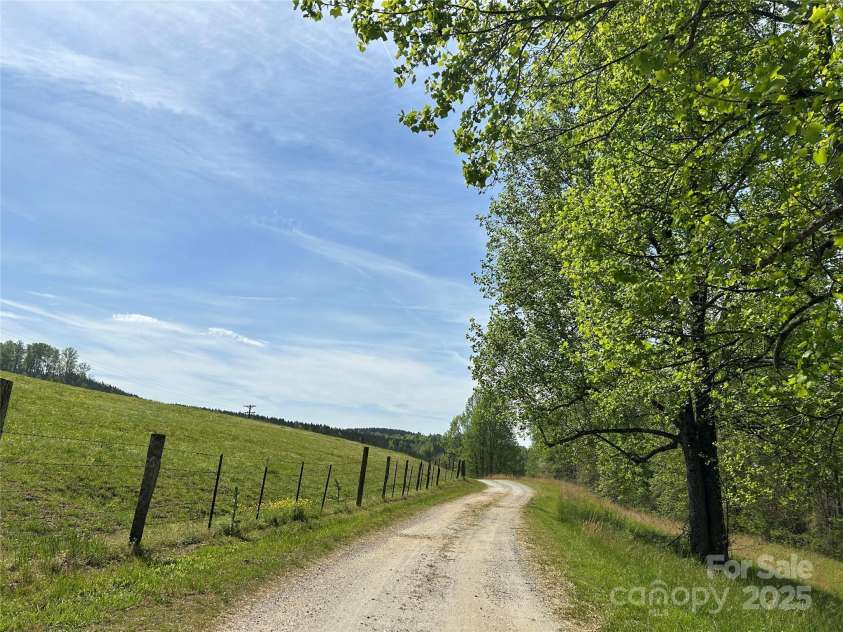 621 Pleasant Grove Road, Rutherfordton, NC 28139.  MLS# CAR4208576, YatesRealty ID 6871. The road going to the metal building.