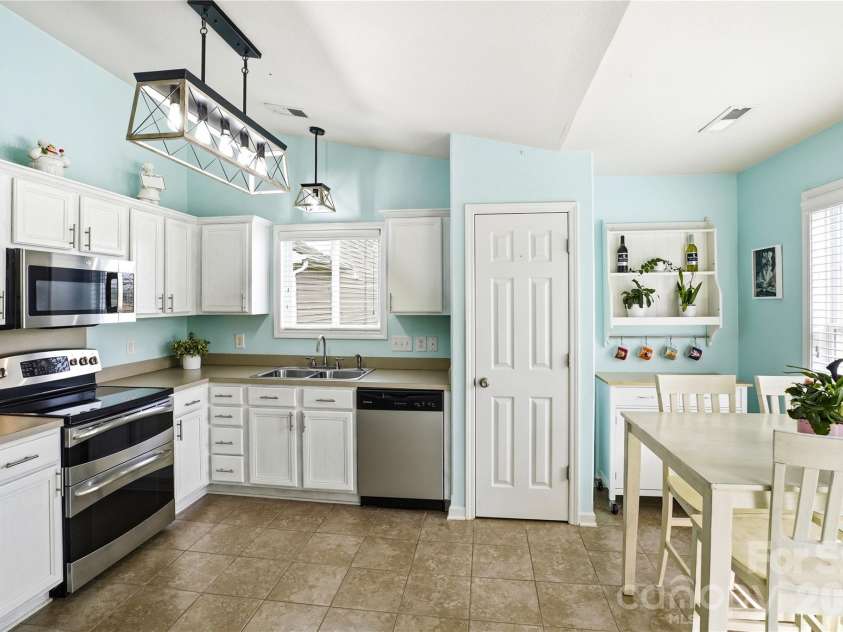 6714 Wicked Oak Lane, Charlotte, NC 28216.  MLS# CAR4357871, YatesRealty ID 6876. Kitchen showcasing freshly updated cabinets and functional design
