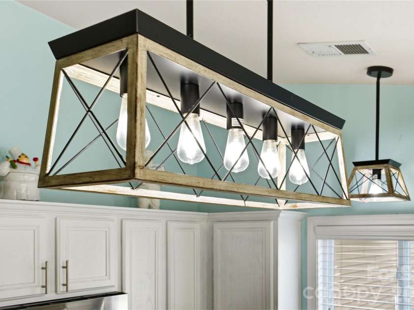 6714 Wicked Oak Lane, Charlotte, NC 28216.  MLS# CAR4357871, YatesRealty ID 6876. Statement lighting fixture adding style and visual interest