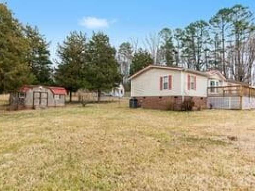 1520 Weaver Road, China Grove, NC 28023.  MLS# CAR4349747, YatesRealty ID 6879. Side Yard