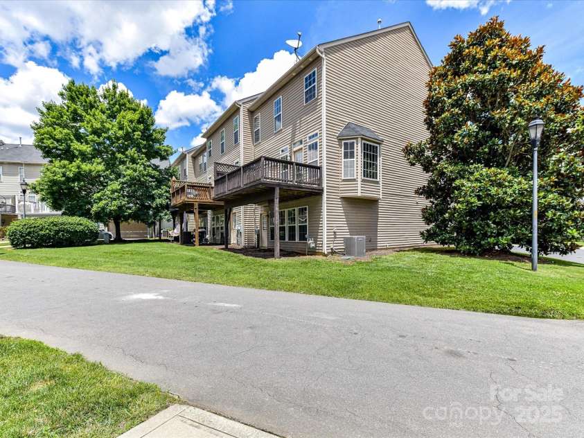 7518 Turley Ridge Lane, Charlotte, NC 28273.  MLS# CAR4272341, YatesRealty ID 688. Back view of the townhome - nice to have the end unit