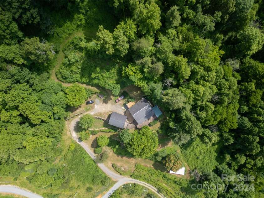 556 Blue Hill Road, Marshall, NC 28753.  MLS# CAR4154163, YatesRealty ID 6887. Fenced reclaimable livestock area on the hill behind the house