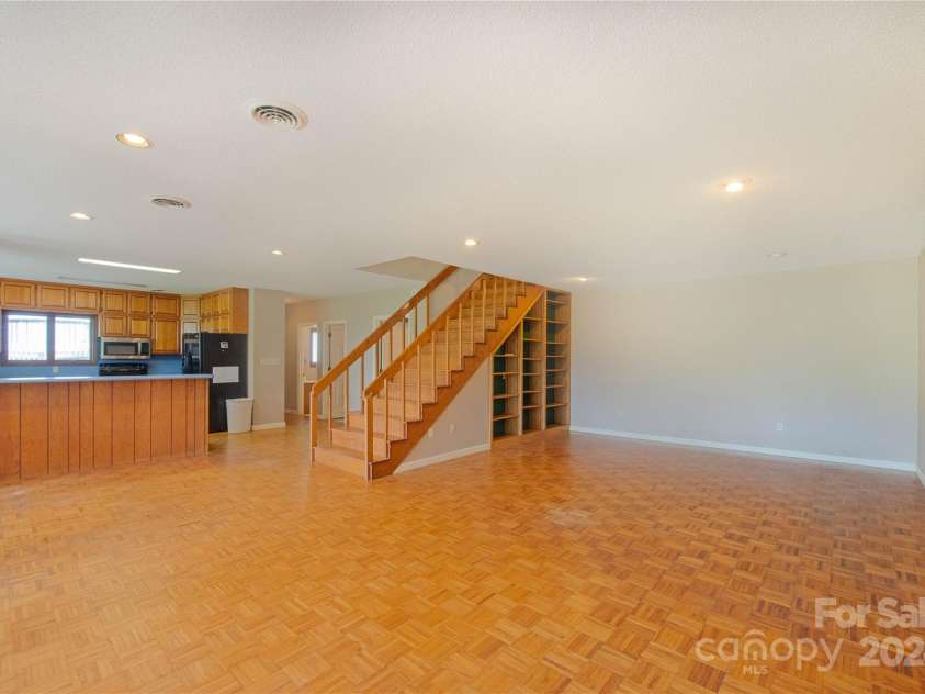 556 Blue Hill Road, Marshall, NC 28753.  MLS# CAR4154163, YatesRealty ID 6887. Main living area with built in book shelves