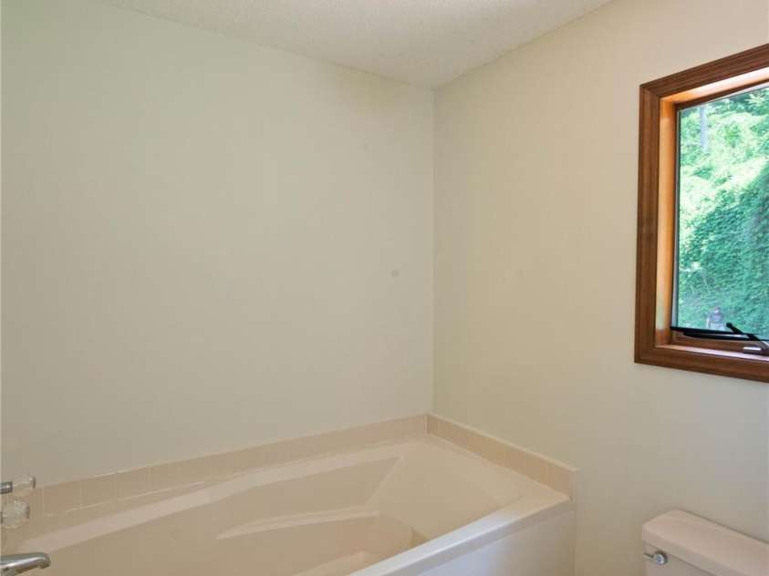556 Blue Hill Road, Marshall, NC 28753.  MLS# CAR4154163, YatesRealty ID 6887. Primary bathroom with large soaking tub