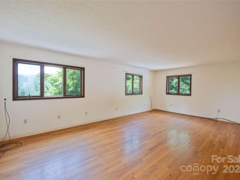 556 Blue Hill Road, Marshall, NC 28753.  MLS# CAR4154163, YatesRealty ID 6887. Primary bedroom