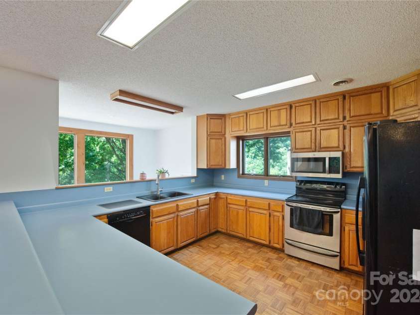 556 Blue Hill Road, Marshall, NC 28753.  MLS# CAR4154163, YatesRealty ID 6887. So many cabinets!