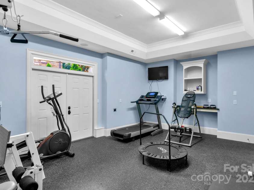 3255 Lake Pointe Drive, Belmont, NC 28012.  MLS# CAR4211520, YatesRealty ID 689. Exercise room or could be workshop as lots of extra outlets added.