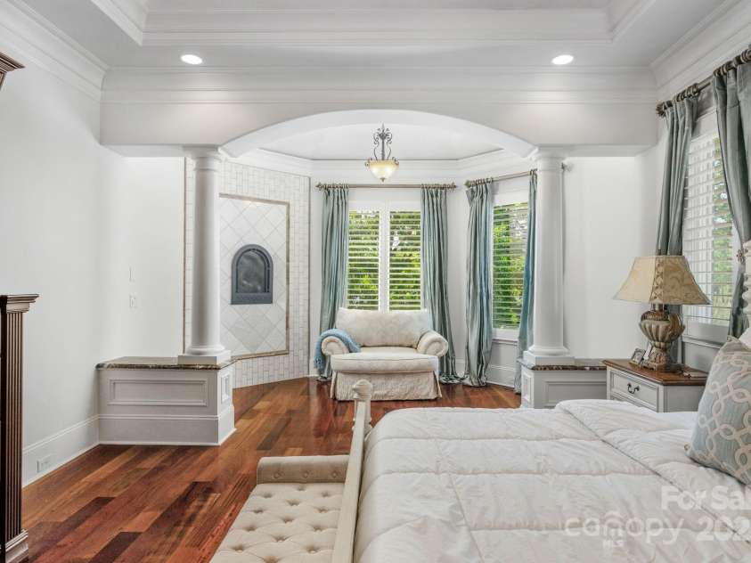 3255 Lake Pointe Drive, Belmont, NC 28012.  MLS# CAR4211520, YatesRealty ID 689. Sitting area in primary w/ FP and water view