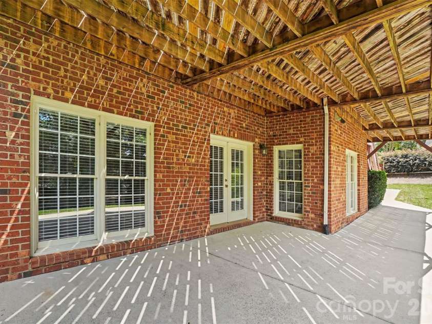 4837 Beth Lane, Harrisburg, NC 28075.  MLS# CAR4353100, YatesRealty ID 6895. Lower covered patio, has access to basement.
