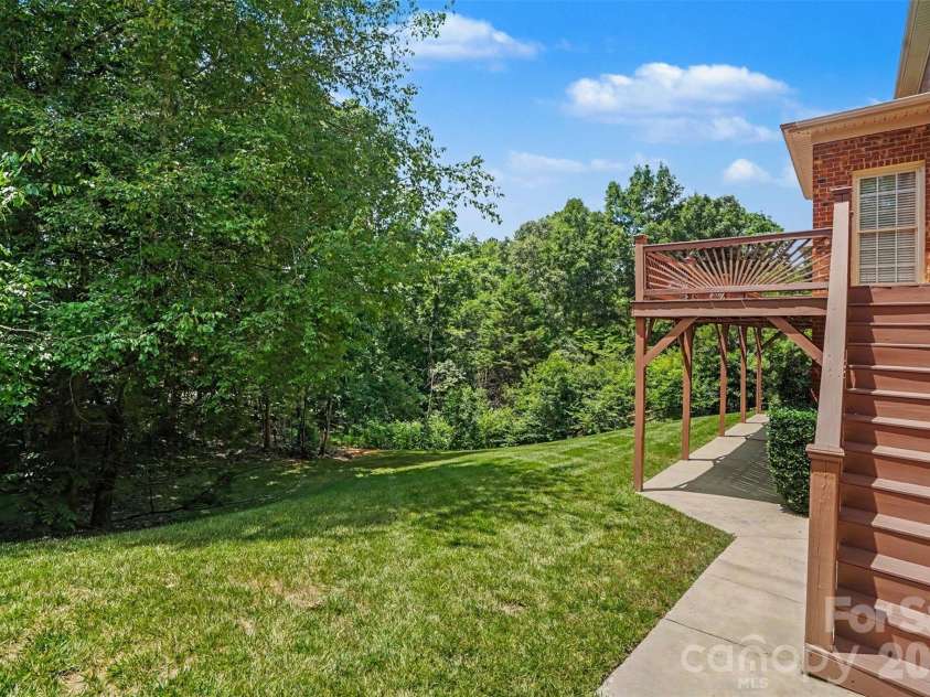 4837 Beth Lane, Harrisburg, NC 28075.  MLS# CAR4353100, YatesRealty ID 6895. Sidewalk from driveway to basement. 
