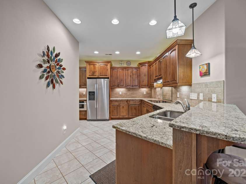 8657 Sonata Court, Denver, NC 28037.  MLS# CAR4321680, YatesRealty ID 690. Great flow in the kitchen keeps the chef involved