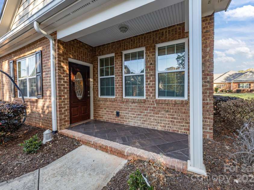 8657 Sonata Court, Denver, NC 28037.  MLS# CAR4321680, YatesRealty ID 690. Inviting front porch sets the tone for this beautiful townhome