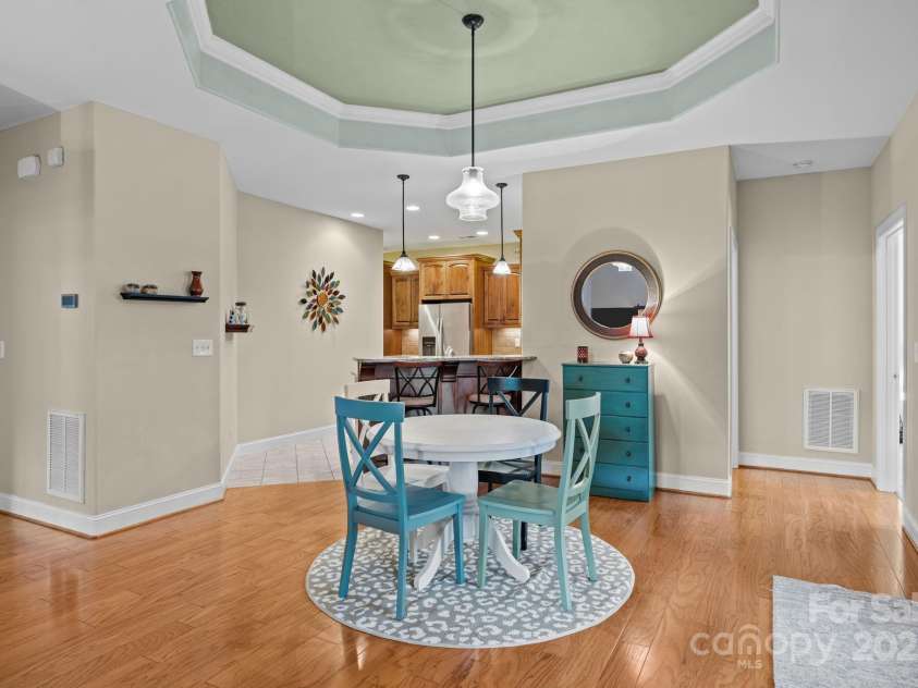 8657 Sonata Court, Denver, NC 28037.  MLS# CAR4321680, YatesRealty ID 690. Living room opens to the dining area with tray ceiling