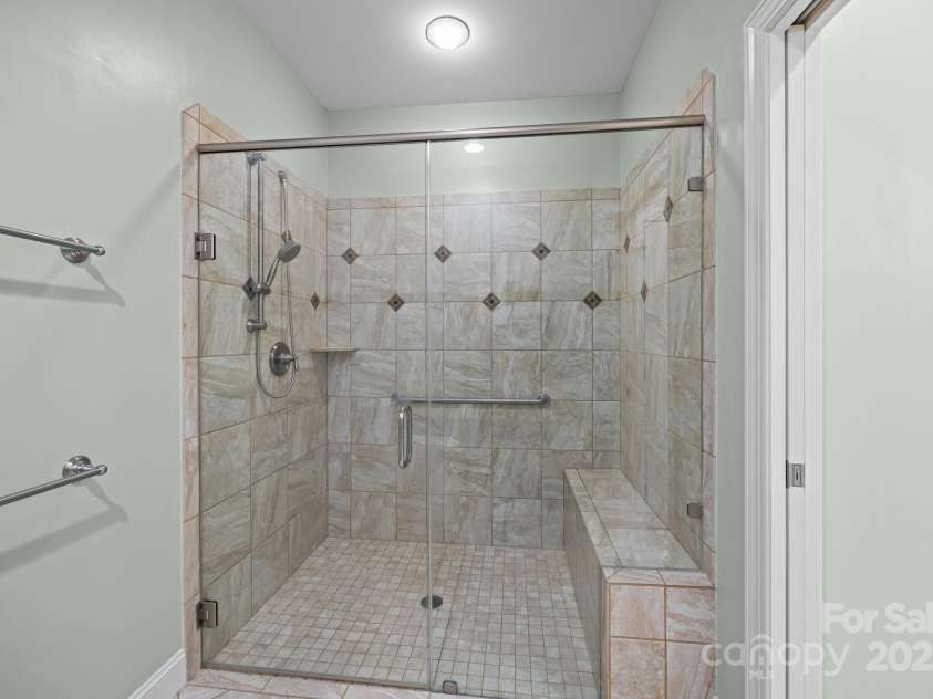 8657 Sonata Court, Denver, NC 28037.  MLS# CAR4321680, YatesRealty ID 690. Oversized, curbless shower in the primary